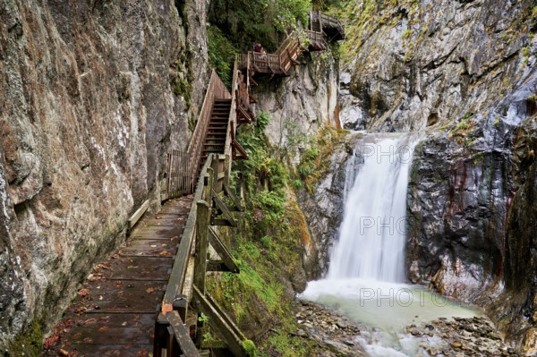 Wooden walkway next to waterfall in the Durnand Gorge, Les Valettes, Canton of Valais, Switzerland