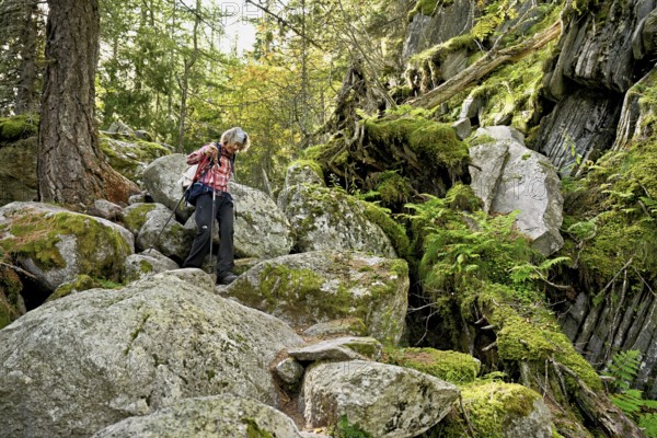 Female hiker on mountain tour in rocky terrain, Mont-Blanc, Chamonix-Mont-Blanc, Haute-Savoie, France