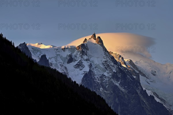 Aiguille du Midi with sun-lit cloud above the summit, Mont-Blanc, Chamonix-Mont-Blanc, Haute-Savoie, France