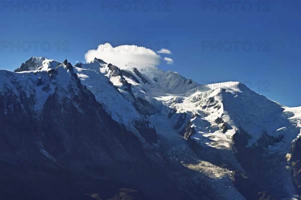 From left snow-covered Aiguille du Midi, Mont-Blanc in the clouds, Vallot Hut, Chamonix-Mont-Blanc, Haute-Savoie, France
