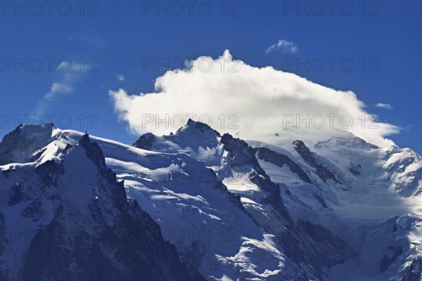 From left snow-covered Mont Blanc du Tacul, Aiguille du Midi, Mont-Blanc in the clouds, Chamonix-Mont-Blanc, Haute-Savoie, France