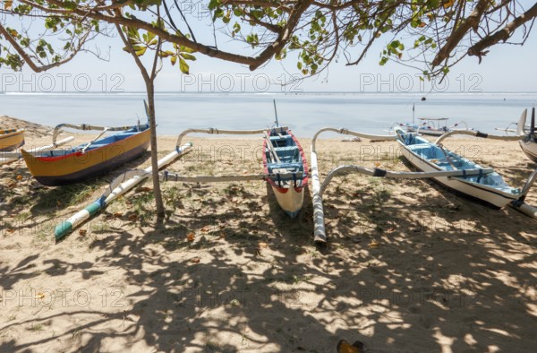 Fishing outrigger boats on Sanur beach, Bali, Indonesia