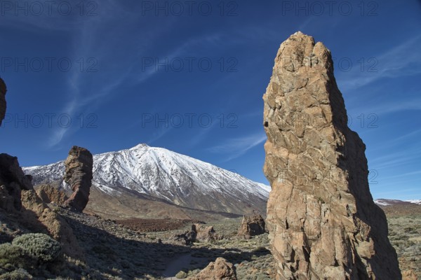 Snow-capped Teide, towering rock formations in front of a snow-capped mountain under clear skies, UNESCO World Heritage Site, Teide National Park, Tenerife, Canary Islands, Spain