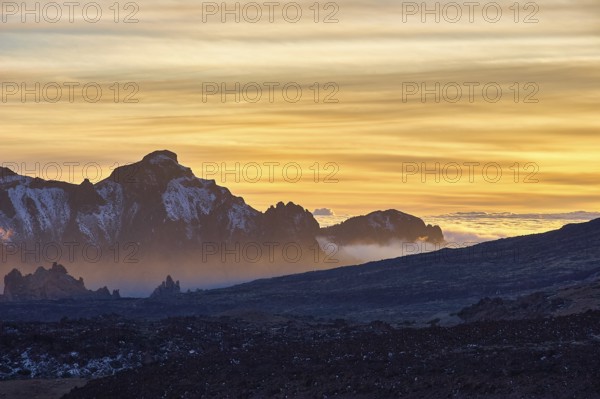 Sunset over mountains with dramatic clouds and silhouettes, UNESCO World Heritage Site, Teide National Park, Teide National Park, Tenerife, Canary Islands, Spain