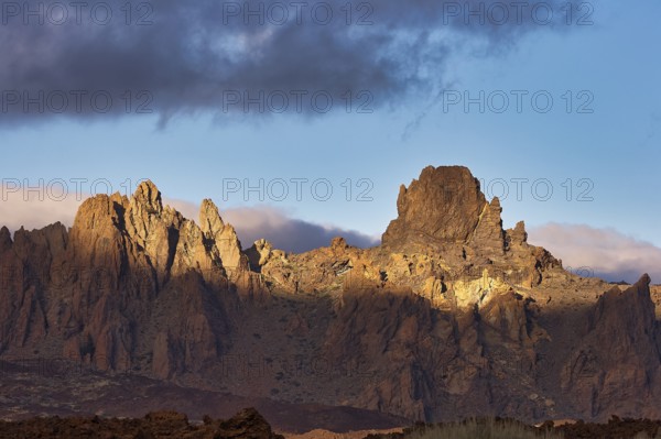 Dramatically illuminated rocks under a partly cloudy sky, UNESCO World Heritage Site, Teide National Park, Teide National Park, Tenerife, Canary Islands, Spain