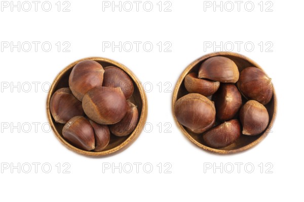 Wooden bowl with raw edible ?hestnuts Isolated on white background, top view, flat lay, close up, minimalism