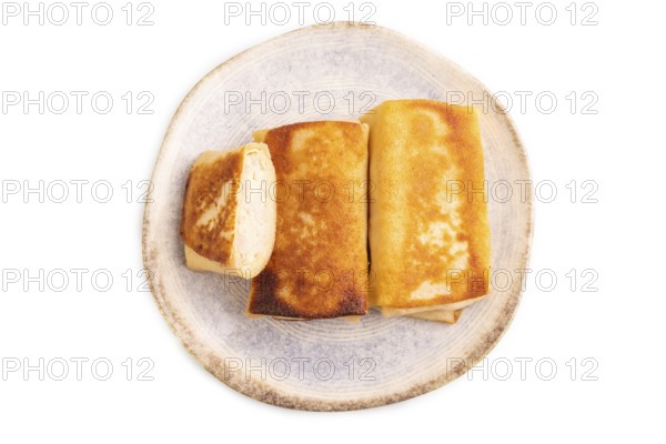 Fried crispy pancakes with meat and cheese isolated on white background. side view, copy space