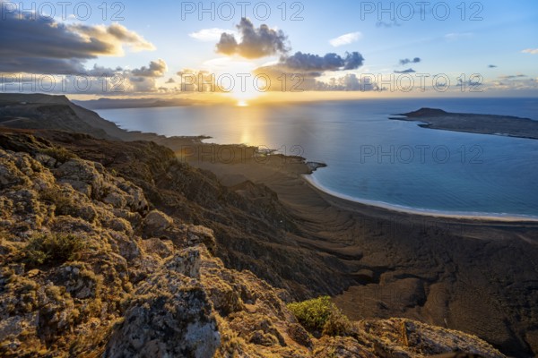 View of steep cliffs on sea and coast, Mirador del Porrito viewpoint at sunset, Lanzarote, Canary Islands, Spain