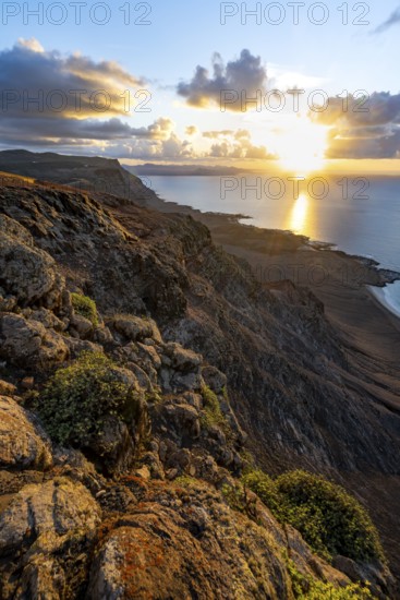 View of steep cliffs on sea and coast, Mirador del Porrito viewpoint at sunset, Lanzarote, Canary Islands, Spain