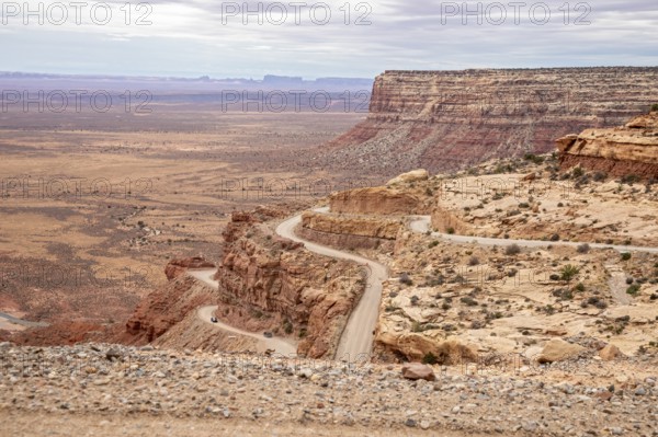 Mexican Hat, Utah - The Moki Dugway, an unpaved road with tight curves and no guardrails which descends 1200 feet from Cedar Mesa. The road was built in the 1950s to transport uranium ore from the mine to a mill