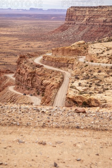 Mexican Hat, Utah - The Moki Dugway, an unpaved road with tight curves and no guardrails which descends 1200 feet from Cedar Mesa. The road was built in the 1950s to transport uranium ore from the mine to a mill