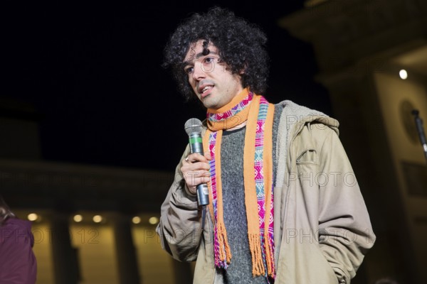 Arshak Makichyan (Russian-Armenian climate activist) speaks at the international climate demo under the motto Fight for 1.5 at the Brandenburg Gate in Berlin on 14.11.2025. The demonstration takes place on the occasion of the COP30 World Climate Conference in Belém, Brazil, and to mark 10 years of the Paris Climate Agreement