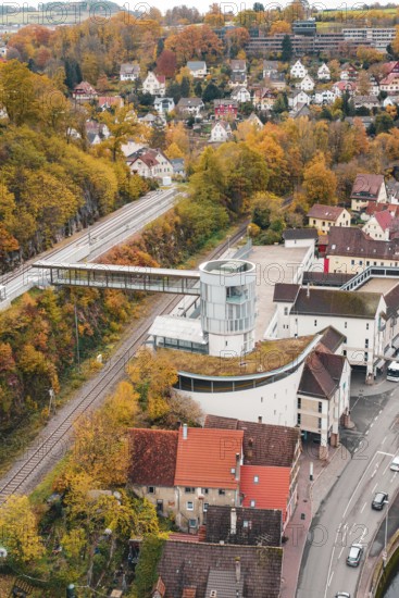 View of urban area with tower and railway tracks in autumn surroundings, Hermann Hessebahn, ZOB Calw, Germany