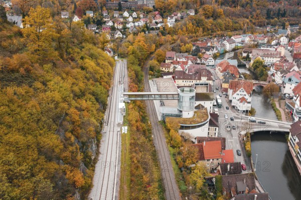 Panoramic view of railway tracks, city and river, with central tower in autumn, Hermann Hessebahn, ZOB Calw, Germany