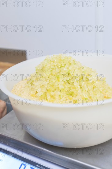 Close-up of a bowl of yellow sugar on a scale in a kitchen, Christmas baking, Haselstaller Hof, Wildberg, Germany