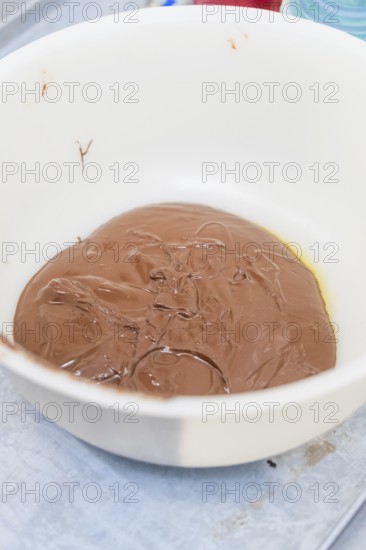 A white bowl of melted chocolate in the kitchen, Christmas baking, Haselstaller Hof, Wildberg, Germany