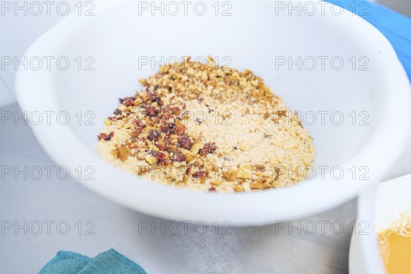 A mix of nuts and berries in a large white bowl, Christmas baking, Haselstaller Hof, Wildberg, Germany