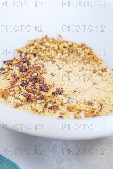 Nuts and berries are well mixed in a white bowl, Weihnachtsbacken, Haselstaller Hof, Wildberg, Germany