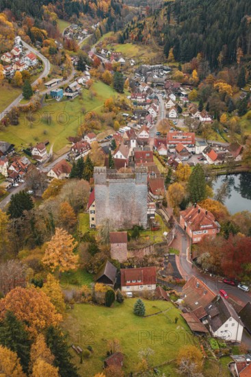 A medieval village surrounds a castle, all bathed in rich autumn colors, Berneck Castle, Altentsteig, Calw District, Germany