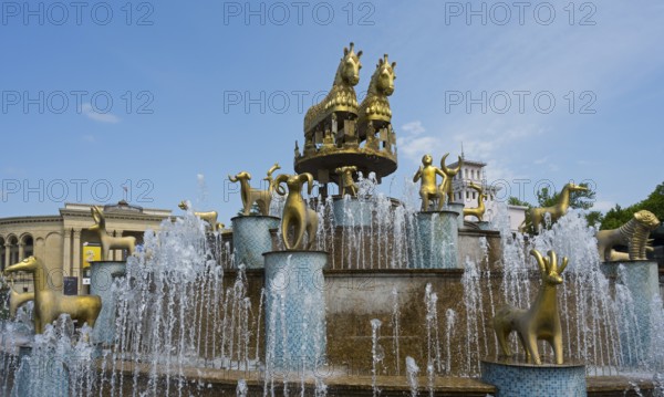 Golden horses and ram statues surrounded by water fountains against an architectural backdrop, Colchis Fountain, David Aghmashenebeli Central Square, Kutaisi, Imereti Region, Georgia
