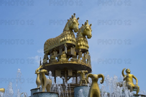 Close-up of golden horses and ram statues above a fountain under a blue sky, Colchis Fountain, David Aghmashenebeli Central Square, Kutaisi, Imereti Region, Georgia