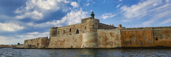 Syracuse, Ortigia island, mighty fortress overlooking the sea under a partly cloudy sky, Baroque towns of Sicily, Baroque corner of Sicily, late Baroque towns of Val di Noto, UNESCO World Heritage Site, Sicily, Italy