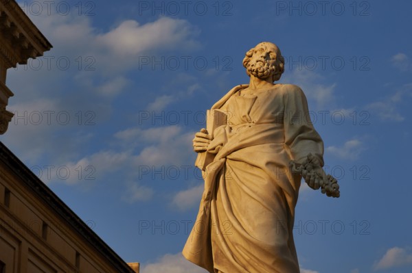 Syracuse, cathedral, imposing ancient statue against a blue, cloudy sky, Baroque towns of Sicily, Baroque corner of Sicily, late Baroque towns of Val di Noto, UNESCO World Heritage Site, Sicily, Italy
