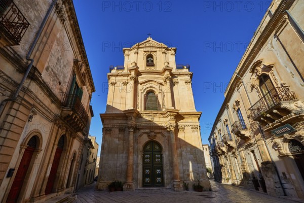 Scigli, beautiful baroque church surrounded by historic buildings in clear weather, Baroque towns of Sicily, Baroque corner of Sicily, late Baroque towns of Val di Noto, UNESCO World Heritage Site, Sicily, Italy