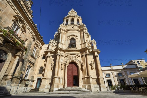 Ragusa, Baroque church with imposing façade against clear blue sky in Sicily, Baroque towns of Sicily, Baroque corner of Sicily, late Baroque towns of Val di Noto, UNESCO World Heritage Site, Sicily, Italy