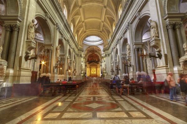 Magnificent church interior with high vaults and sculptures, enlivened by lights and visitors, Palermo, cathedral, UNESCO World Heritage Site, Sicily, Italy