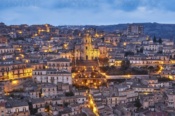 Duomo di San Giorgio, St. George's Cathedral, Modica, night scene of an illuminated city with church in a hilly landscape, Baroque towns of Sicily, Baroque corner of Sicily, late Baroque towns of the Val di Noto, UNESCO World Heritage Site, Sicily, Italy