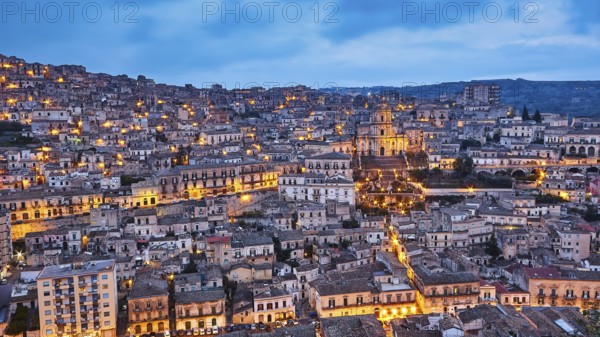 Modica, Duomo di San Giorgio, St. George Cathedral, extensive overview of an illuminated historic city at night, Baroque towns of Sicily, Baroque corner of Sicily, late Baroque towns of the Val di Noto, UNESCO World Heritage Site, Sicily, Italy