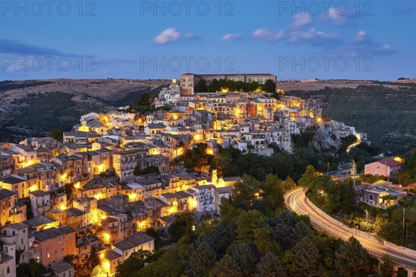 Ragusa, illuminated hill town view at dusk with atmospheric atmosphere, Baroque towns of Sicily, Baroque corner of Sicily, late Baroque towns of Val di Noto, UNESCO World Heritage Site, Sicily, Italy