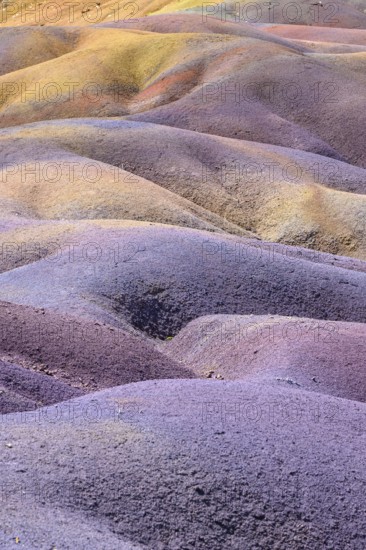 Colourful, wavy landscape in pastel colors with earthy tones and fascinating textures. Africa, East Africa, Mauritius, Chamarel, Seven Coloured Earth