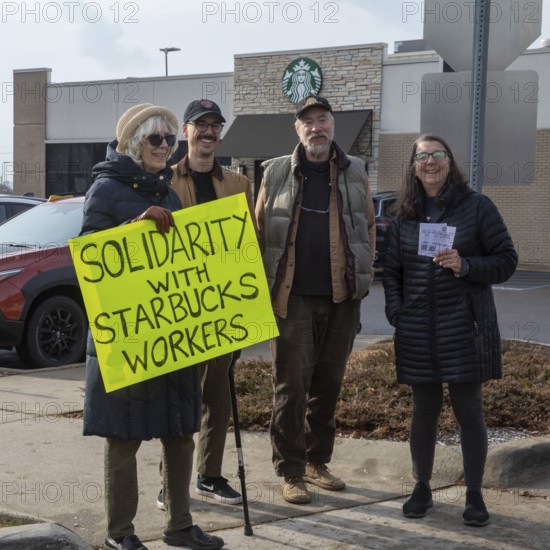 Detroit, Michigan USA - 15 November 2025 - People picket a Starbucks store in solidarity with a strike going on at the company's unionized stores. The picketers asked would-be customers to get their coffee elsewhere