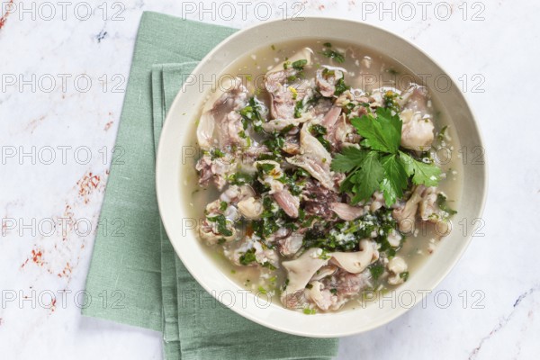 Muzhuzhi, a Georgian dish made from pork legs, with spices and herbs, homemade
