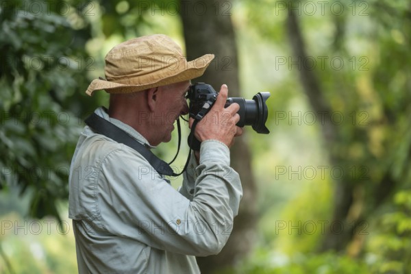 Photographer taking pictures, Amani Nature Forest Reserve, Eastern Usambara Mountains, Tanga, Tanzania