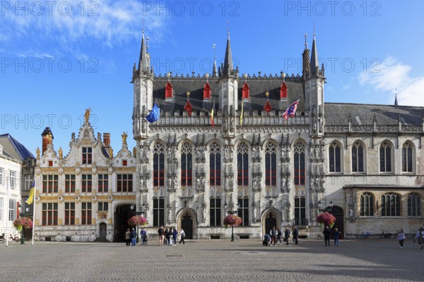 Historic Town Hall of Bruges on Castle Square, Stadhuis, (center of picture) as well as former court building today City Archive (left) and Basilica of the Holy Blood (right), Bruges, UNESCO World Heritage Site, Flanders, Belgium