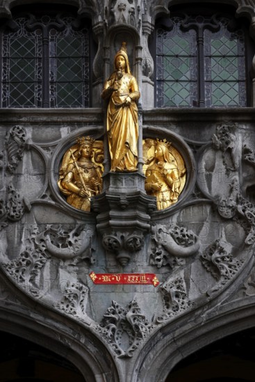 Golden figures on the richly decorated façade of the St. Ivo Chapel at the Basilica of the Holy Blood, Castle Square in the historic old town, Bruges, UNESCO World Heritage Site, Flanders, Belgium