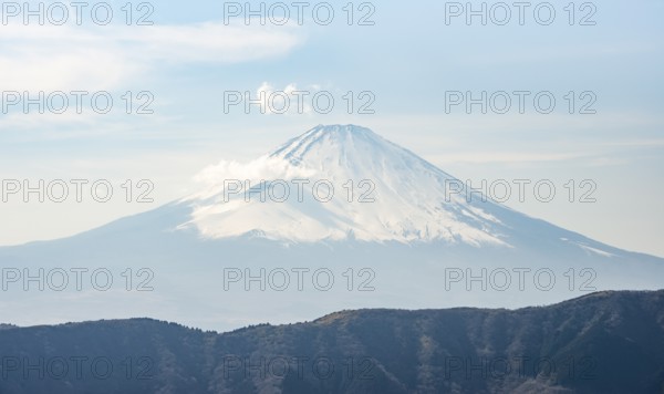 Snow-covered summit of Mount Fuji volcano in spring, Owakudani, Hakone, Japan