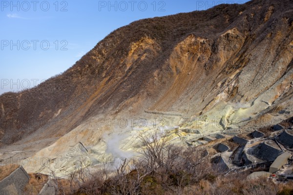 Steaming fumaroles in the Owakudani geothermal area at Komagatake volcano, Hakone, Japan