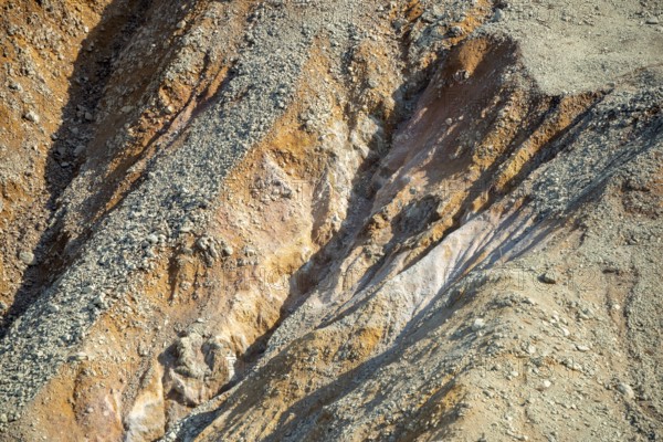 Red and yellow rocks in the Owakudani geothermal area at Komagatake Volcano, Hakone, Japan