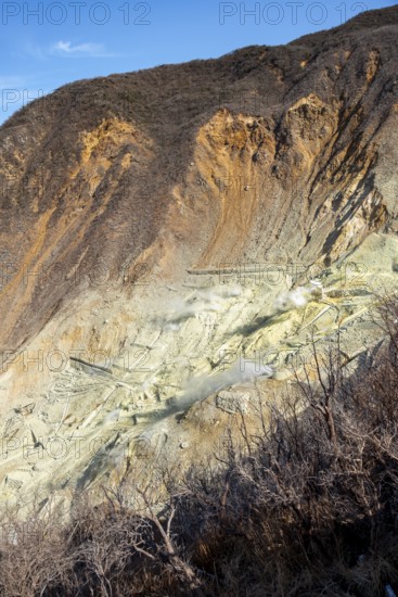 Steaming fumaroles in the Owakudani geothermal area at Komagatake volcano, Hakone, Japan