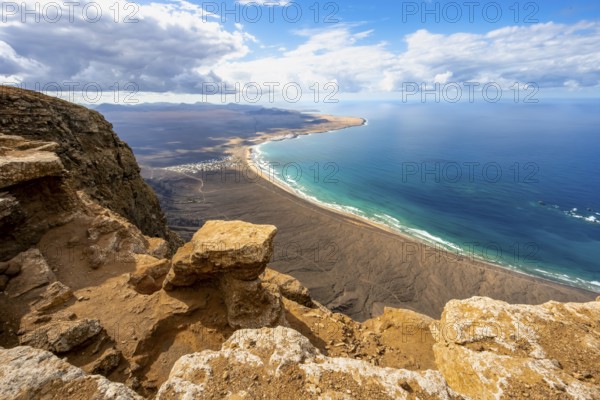 View from the Risco de Famara Cliff to Famara Beach, Playa de Famara with La Calaeta, Lanzarote, Canary Islands, Spain