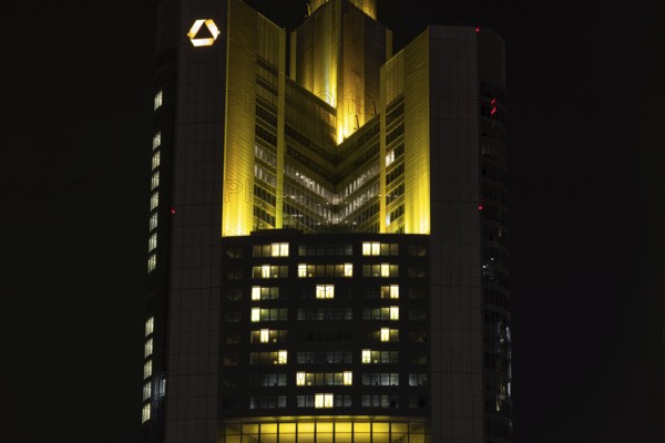 Lights inside the offices project a glowing yellow heart onto the façade of the Commerbank Tower in Frankfurt am Main, Frankfurt am Main, Hesse, Germany