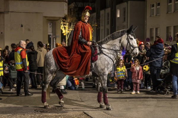 Martinszug in Essen-Rüttenscheid, the parish of St. Lambertus, Saint Martin actor on a horse, with over 500 participants, North Rhine-Westphalia, Germany