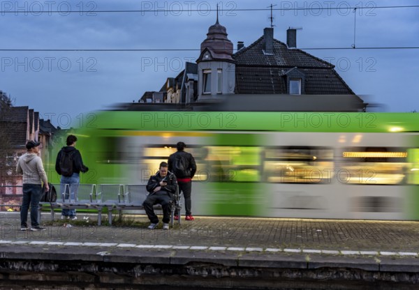 Essen-Steele S-Bahn station, passengers waiting for the train late afternoon, in autumn, Essen, North Rhine-Westphalia, Germany