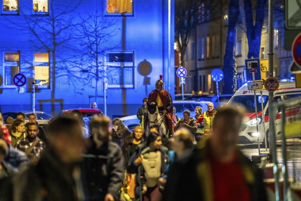 Safety at the Martin train in Essen-Rüttenscheid, the parish of St. Lambertus, accompanied by police and rescue services, Saint Martin performer on a horse, with over 500 participants, North Rhine-Westphalia, Germany