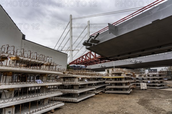 Storage space for building materials at the A40 Neuenkamp bridge, in Duisburg-Homberg, pillars and cables of the new motorway bridge across the Rhine near Duisburg, construction phase of the 2nd bridge structure, North Rhine-Westphalia, Germany
