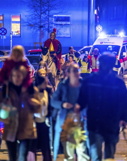 Safety at the Martin train in Essen-Rüttenscheid, the parish of St. Lambertus, accompanied by police and rescue services, Saint Martin performer on a horse, with over 500 participants, North Rhine-Westphalia, Germany